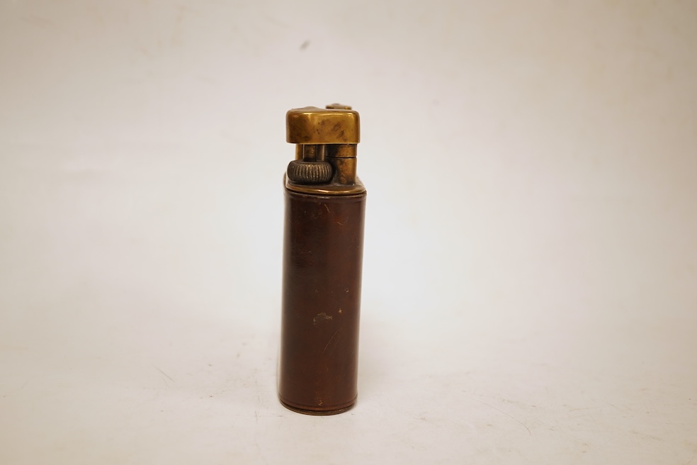 A Dunhill giant table lighter with brown leather outer cover, 11cm